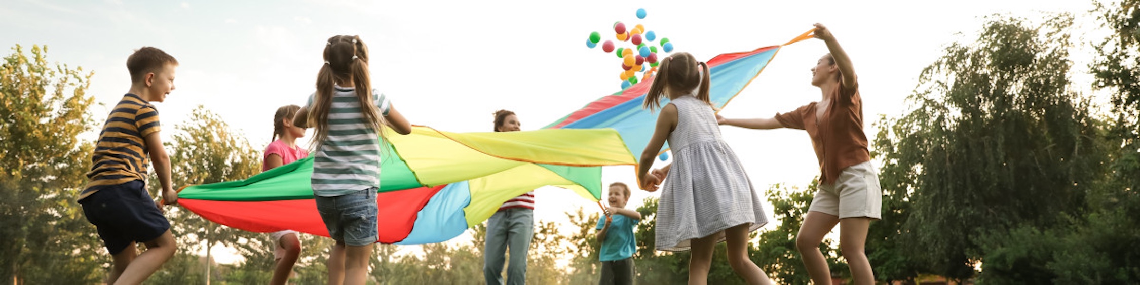 Children playing with a parachute.
