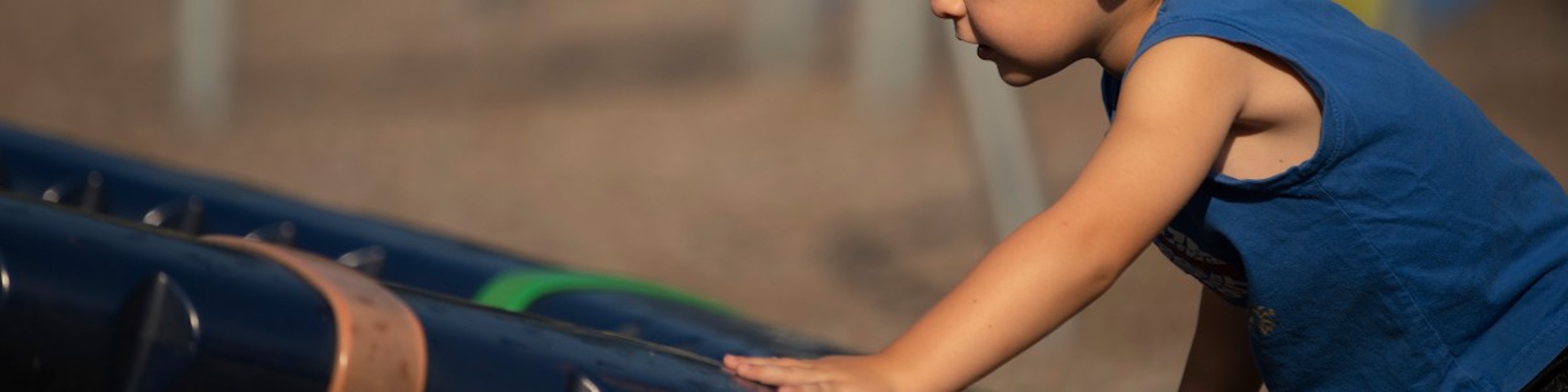 Child climbing ladder.