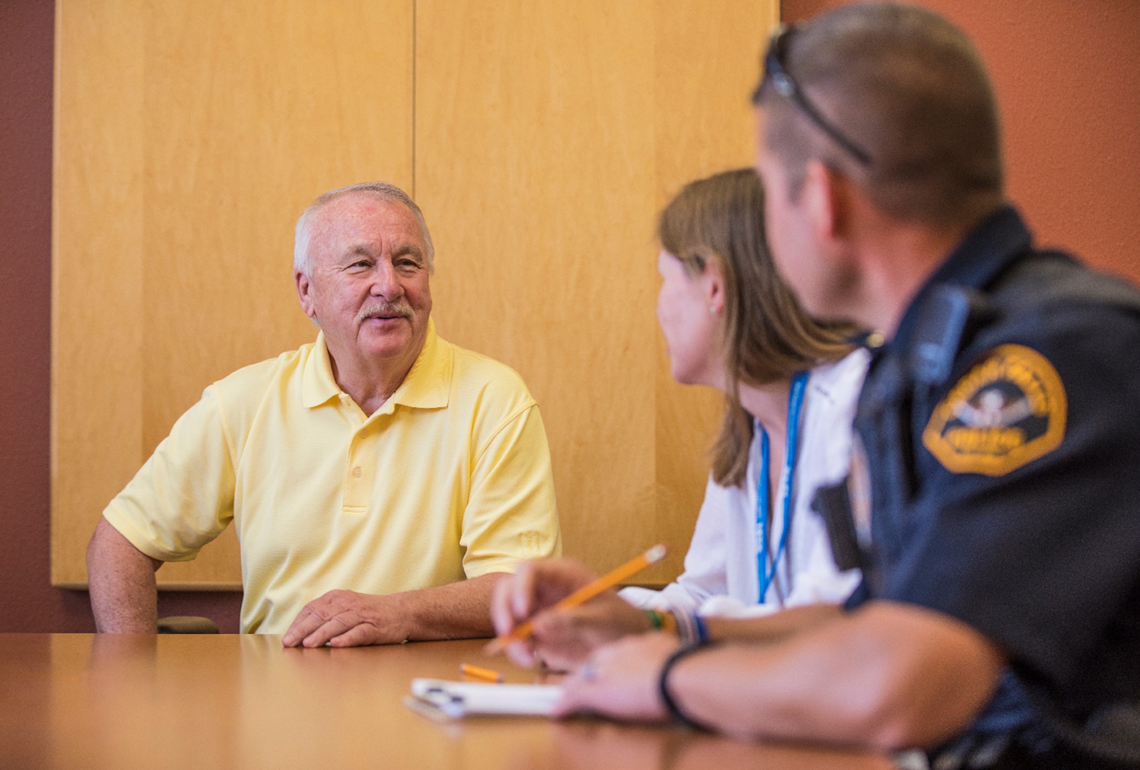 Police talking to a teacher.