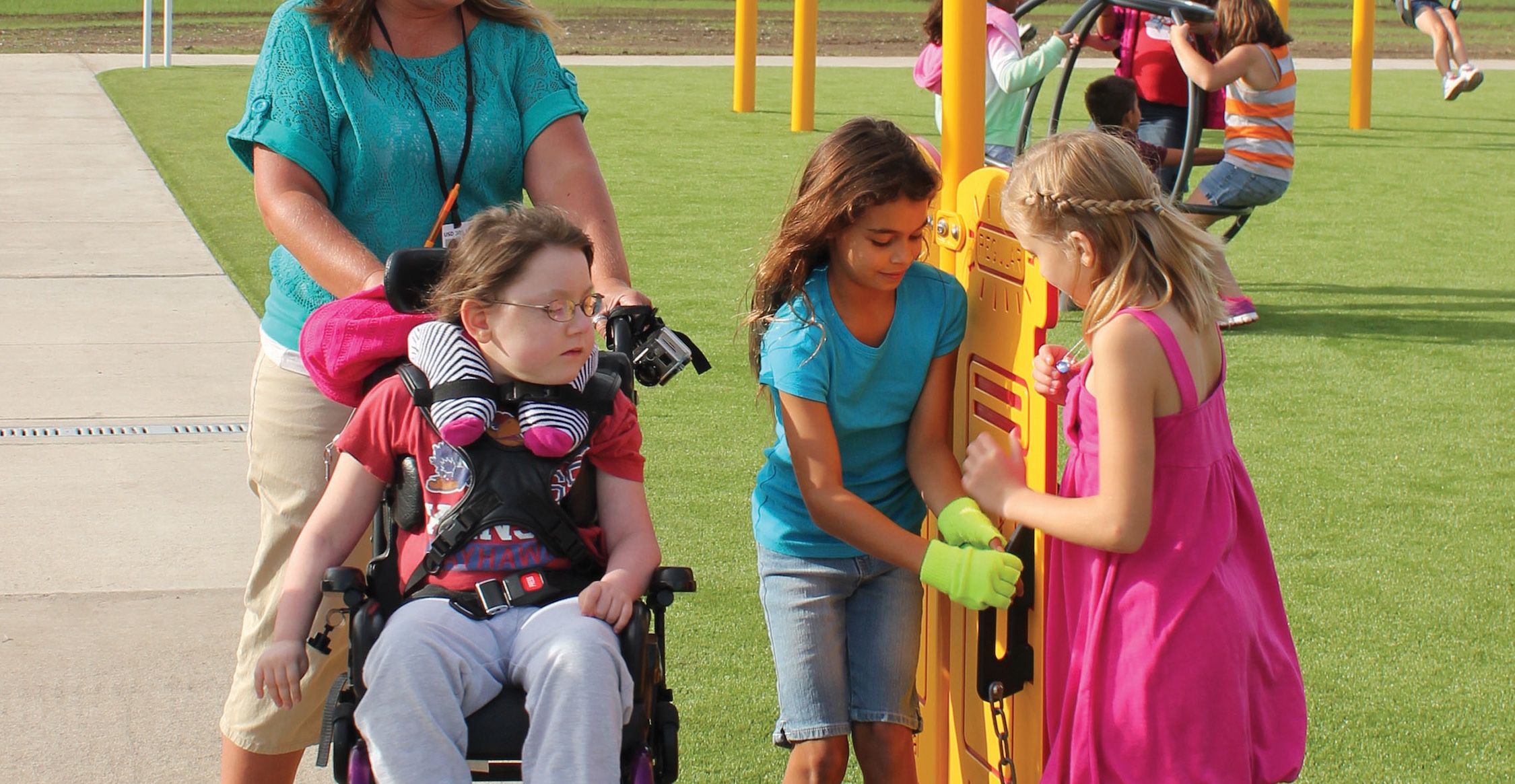  Child in wheelchair playing.