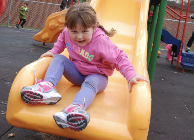 Child playing on a slide.