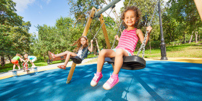 Children swinging on playground